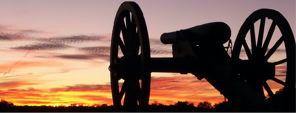 Picture of canon at sunset in battlefield
